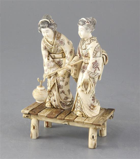 A Japanese ivory okimono of two bijin, first half 20th century, height 15cm